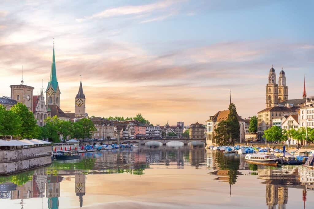 Aerial view on the downtown of Zurich at sunset and its reflection