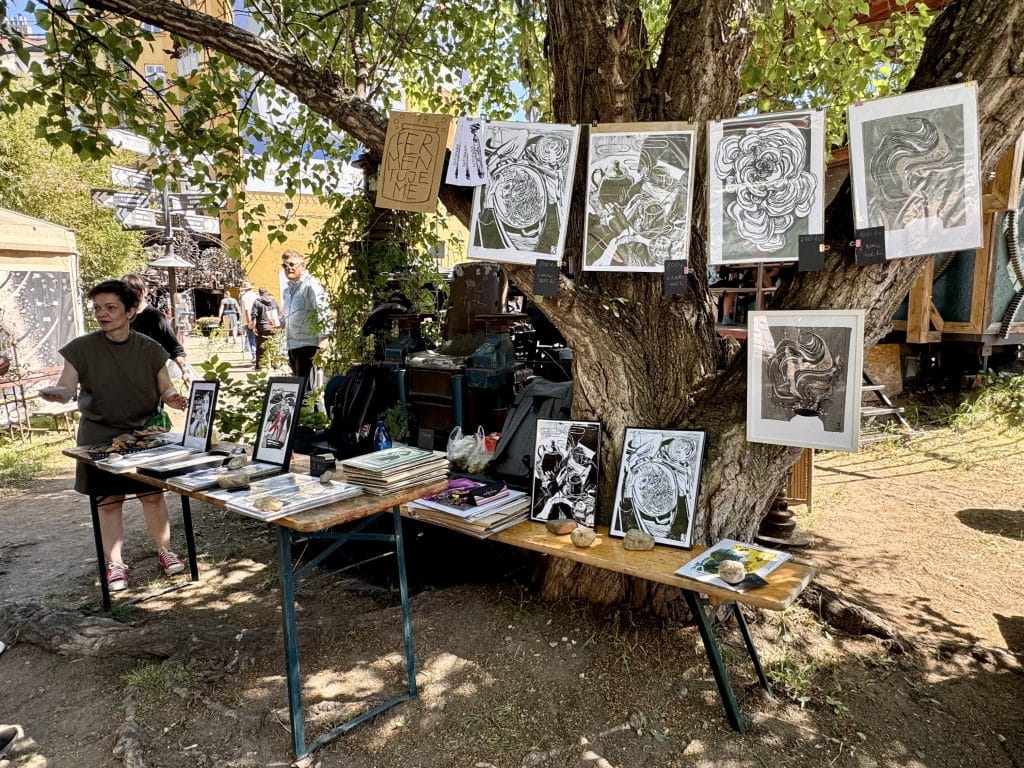 An art display of several prints, hung from a laundry line.