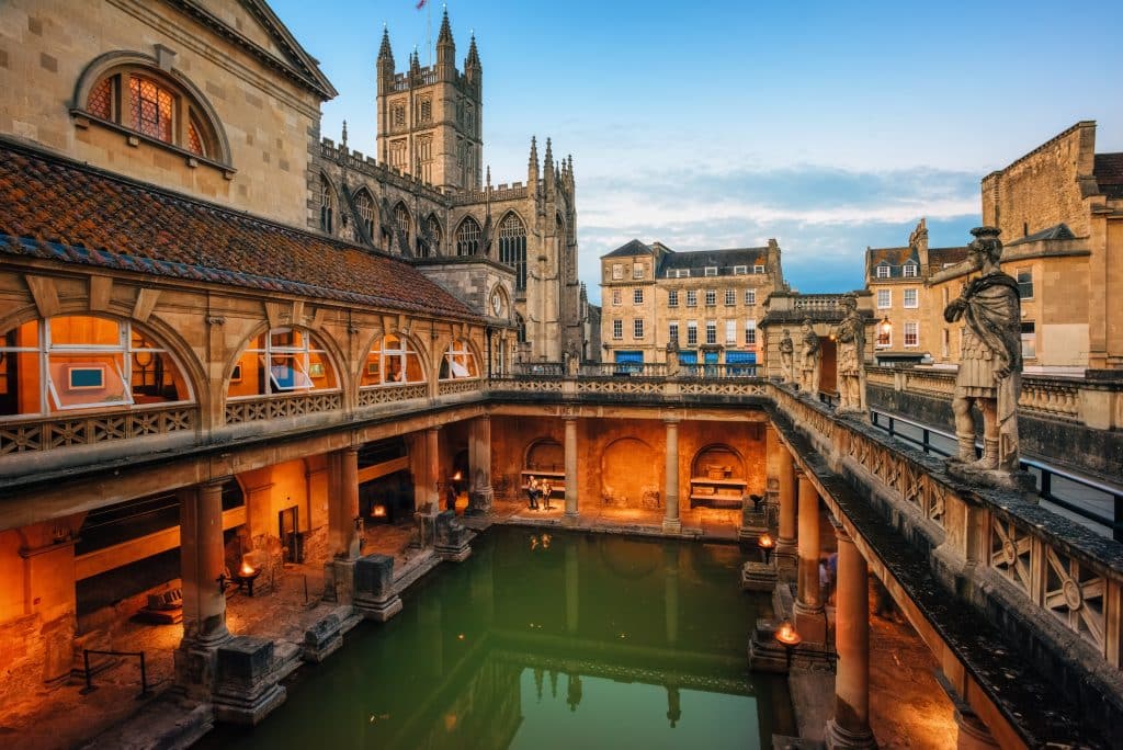 The ancient Roman baths of Bath, England, surrounded by Georgian architecture.
