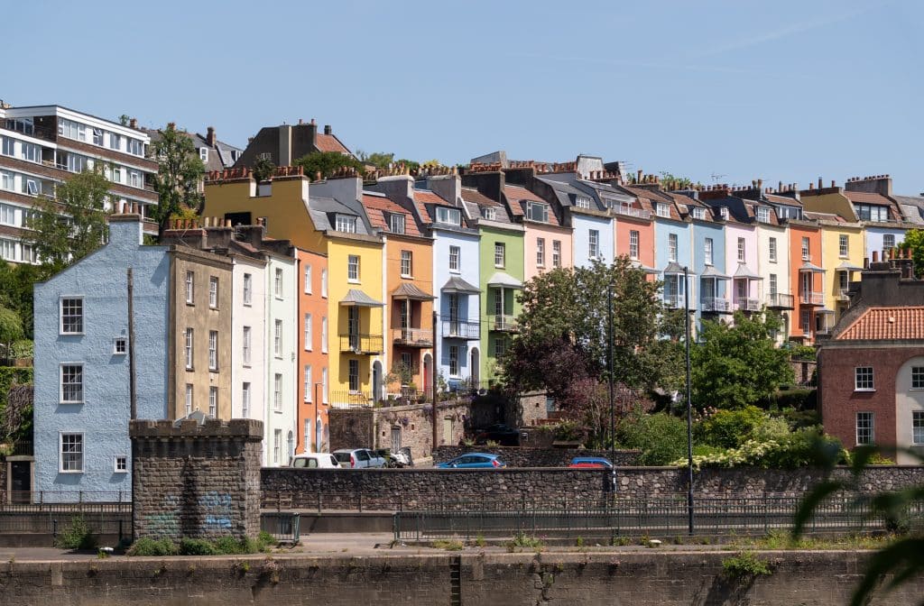 Row houses painted bright colors in Bristol, England.