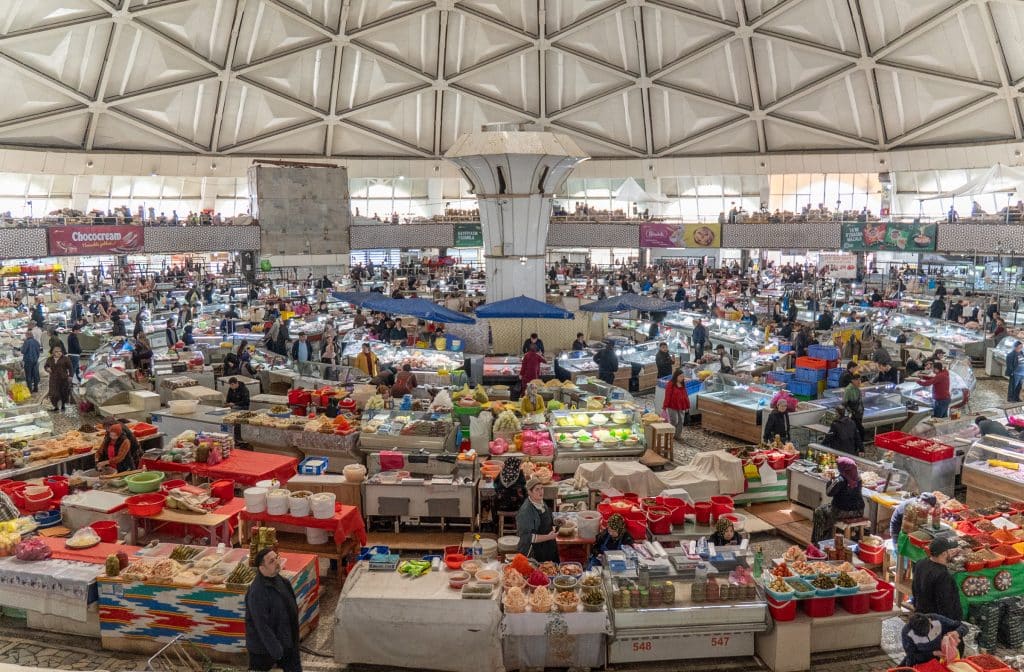 The busy round Chorsu Bazaar, with a geometrically patterned ceiling.