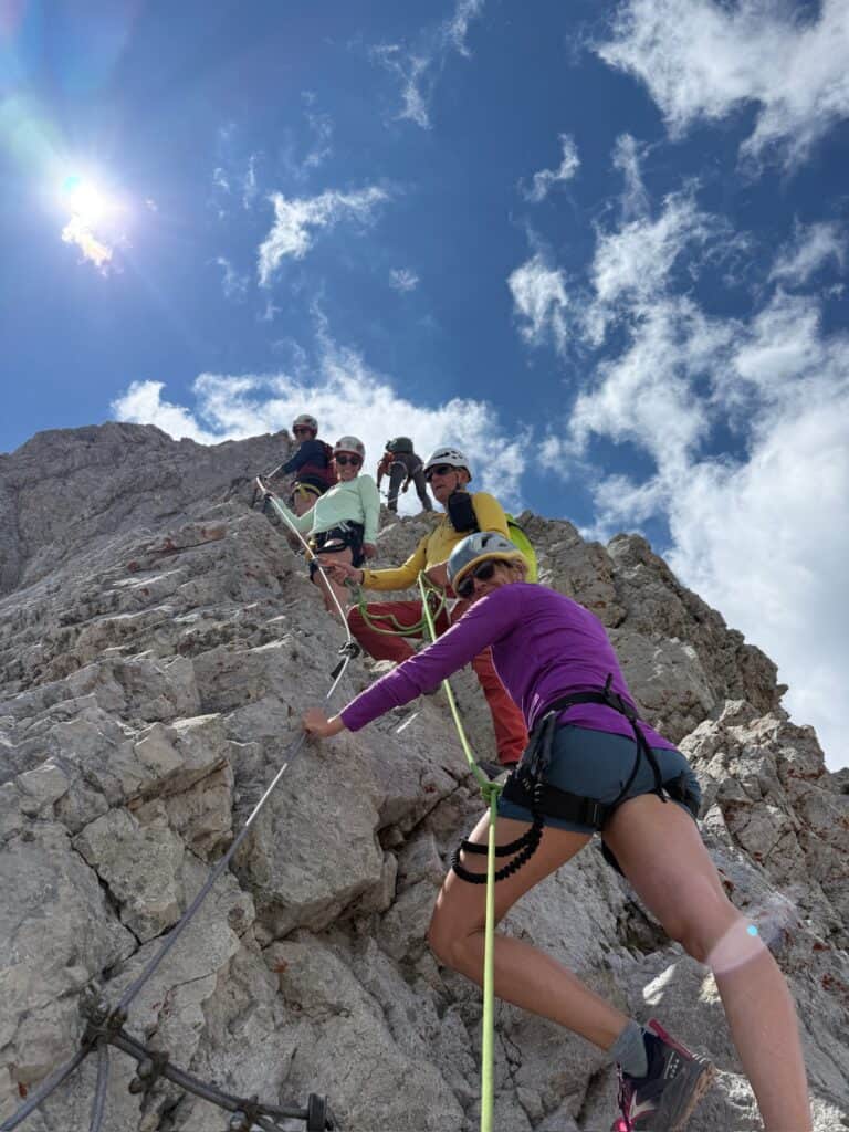 women climbing via ferrata mt triglav slovenia