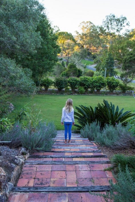 girl walking in a garden