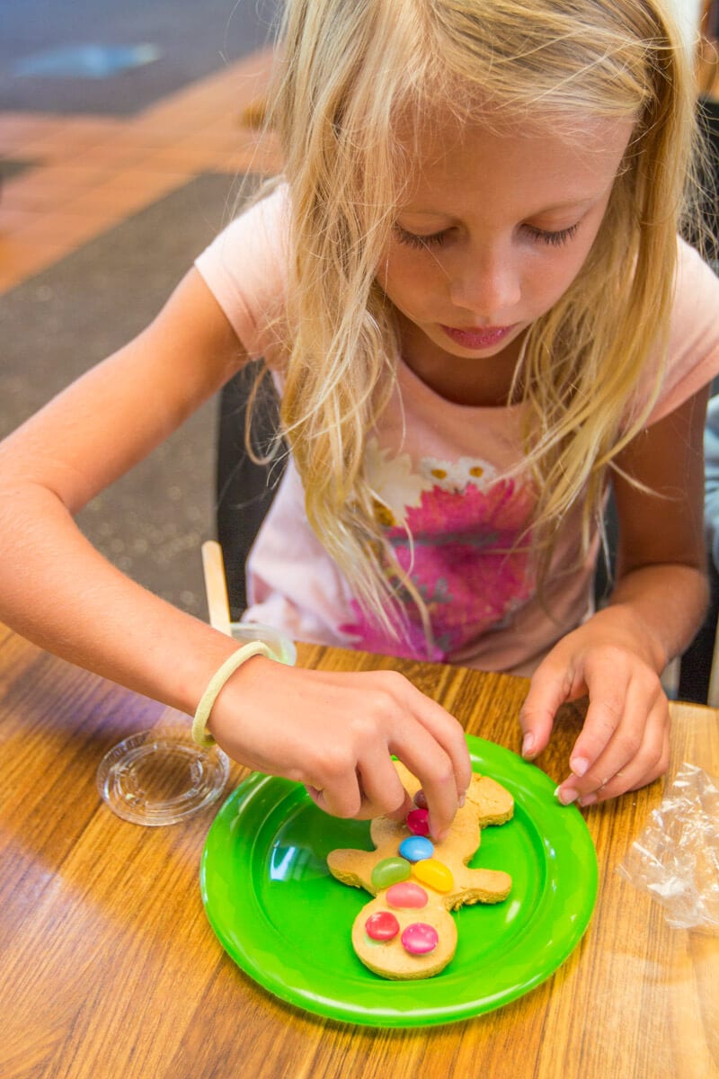 A little girl sitting at a table