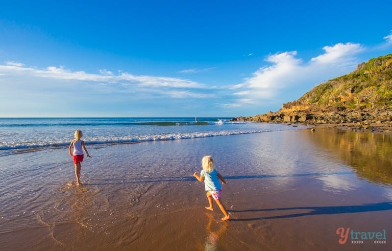 young girls playing on beach at Agnes Water -