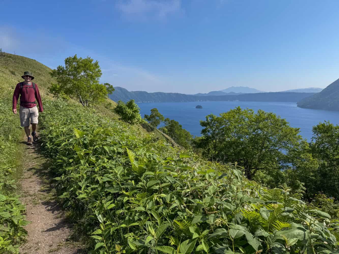 Walking along the ridge above Lake Mashu on the hike to Mt Mashu in Hokkaido.