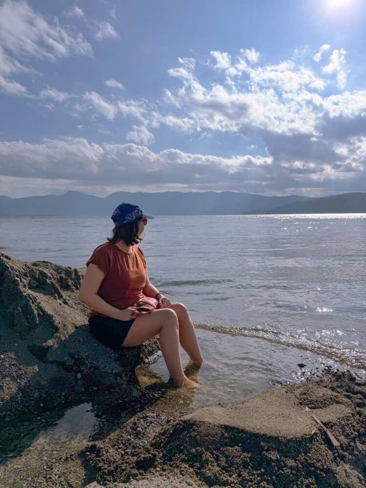 Erin enjoying a foot bath in the sand at Sunayu beach at Lake Kussharo, Hokkaido.