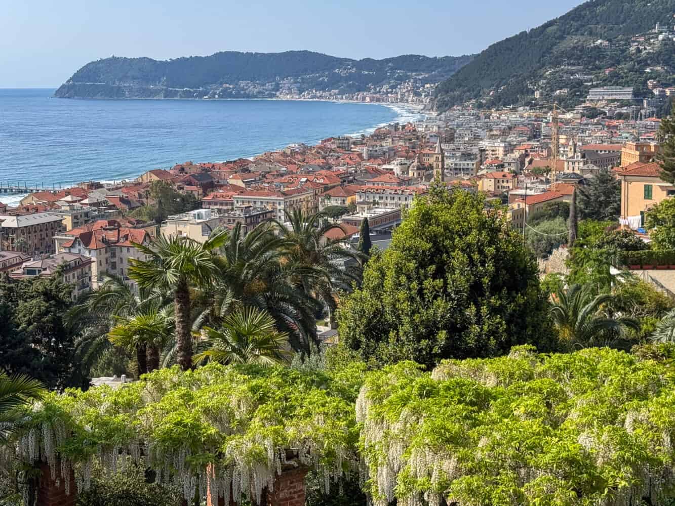 View of Alassio with wisteria at the gardens of Villa della Pergola in Alassio, Italy.
