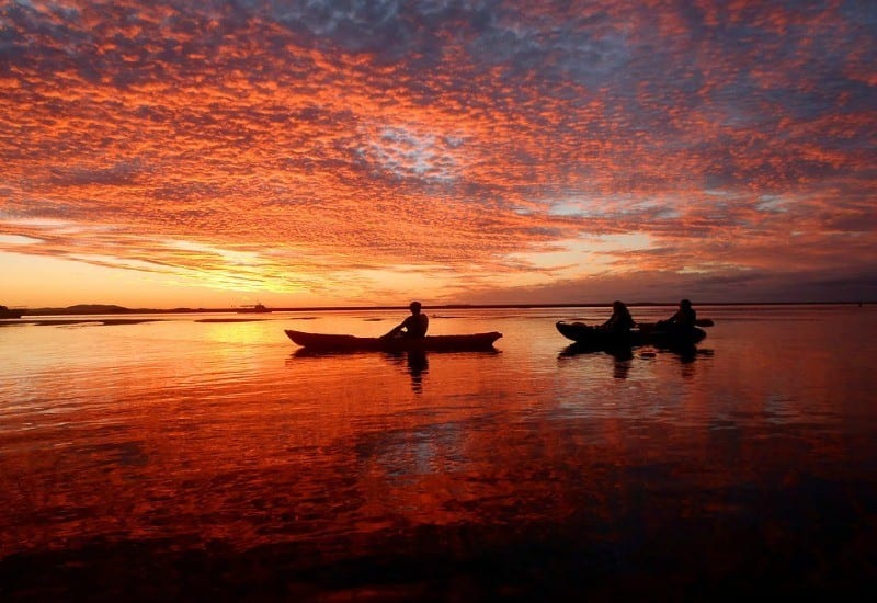 A sunset over a body of water