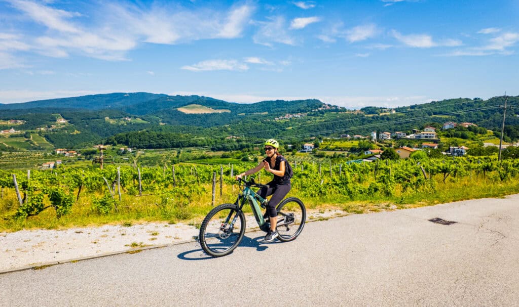woman bike riding in Goriška Brda, Slovenia