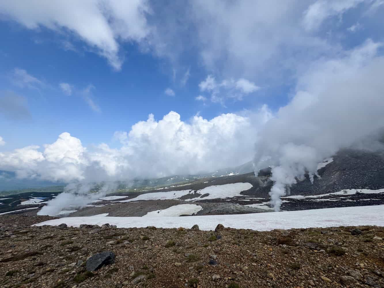 Steaming fumaroles and snow on the hike to Mt Asahidake summit in Hokkaido.