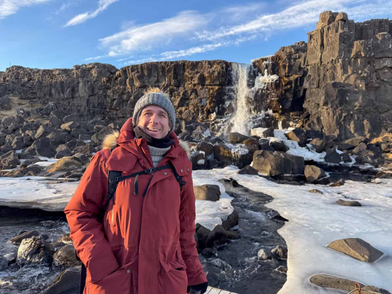 Simon at Oxararfoss Waterfall in Thingvellir National Park, icy in January.