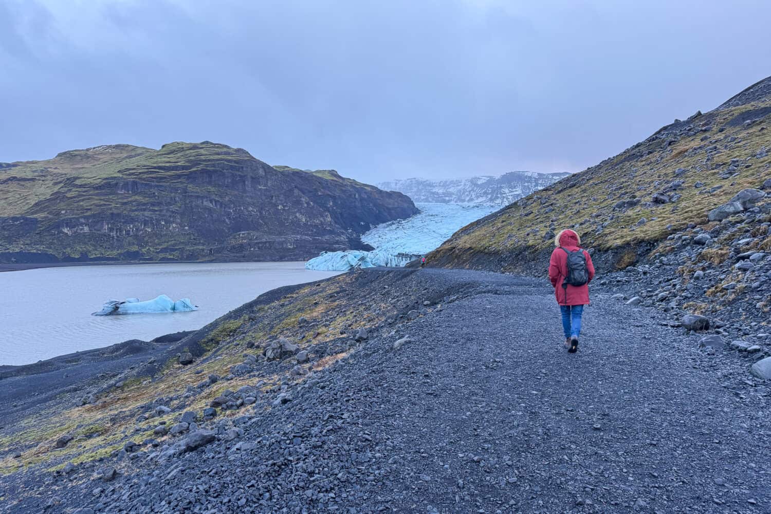 Walking towards Solheimajökull Glacier Tongue in South Iceland.