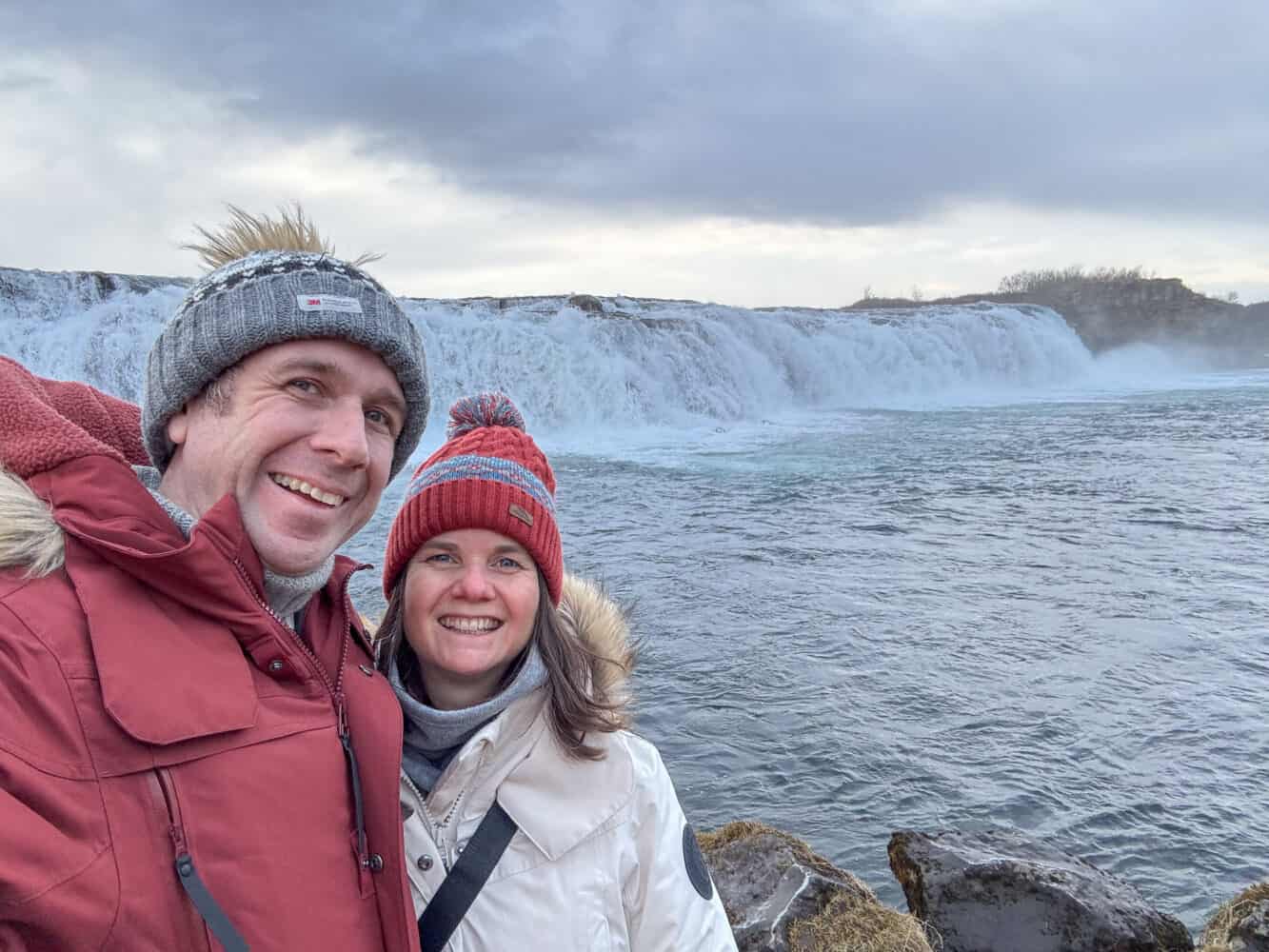 Simon and Erin at Faxafoss waterfall on the Golden Circle in Iceland in winter.