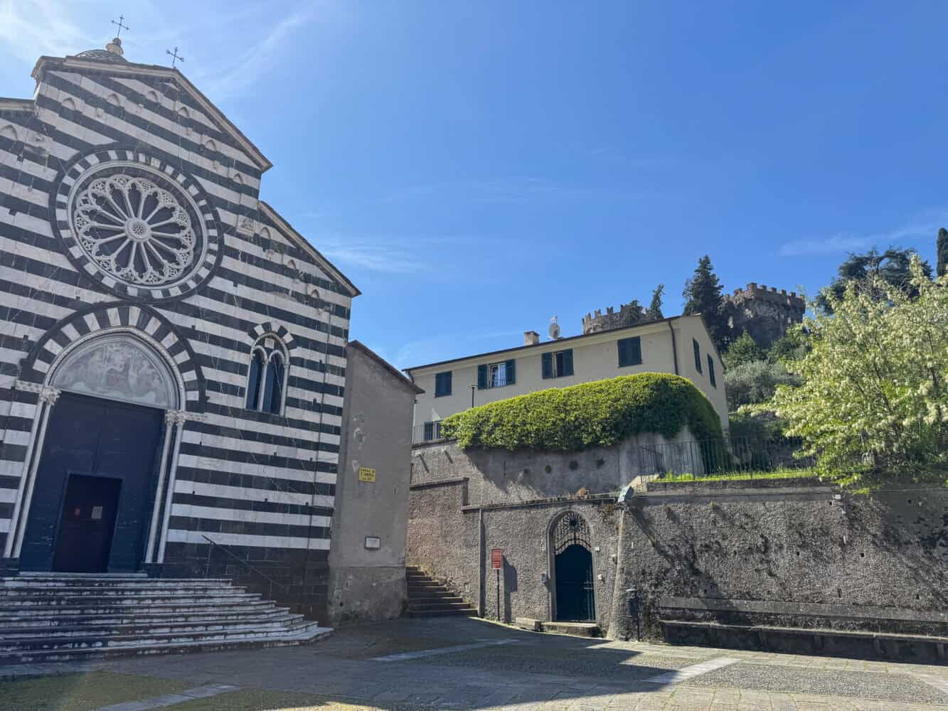 Black and white striped church San Andrea in Levanto, Italy.