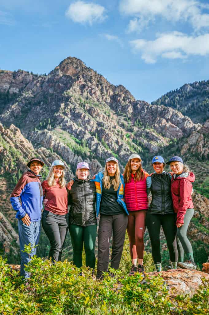 group of women standing at view of mountains