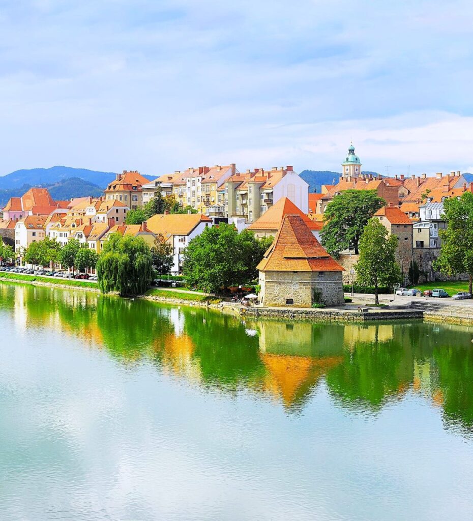 View of Maribor with reflection in the Drava river, Slovenia