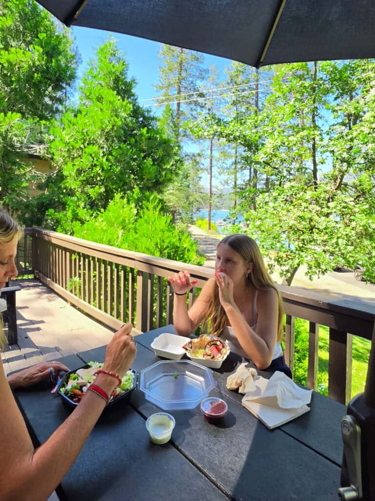 family on deck of cabin at millers landing bass lake