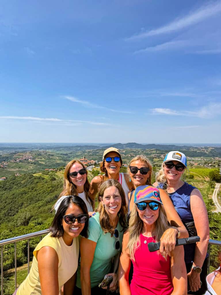 girls taking photo on top of Gonjače tower with a view