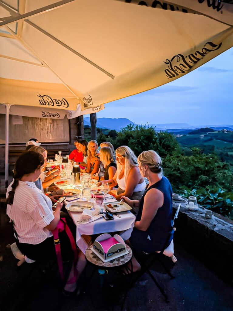 diners at night overlooking Goriška Brda vineywards