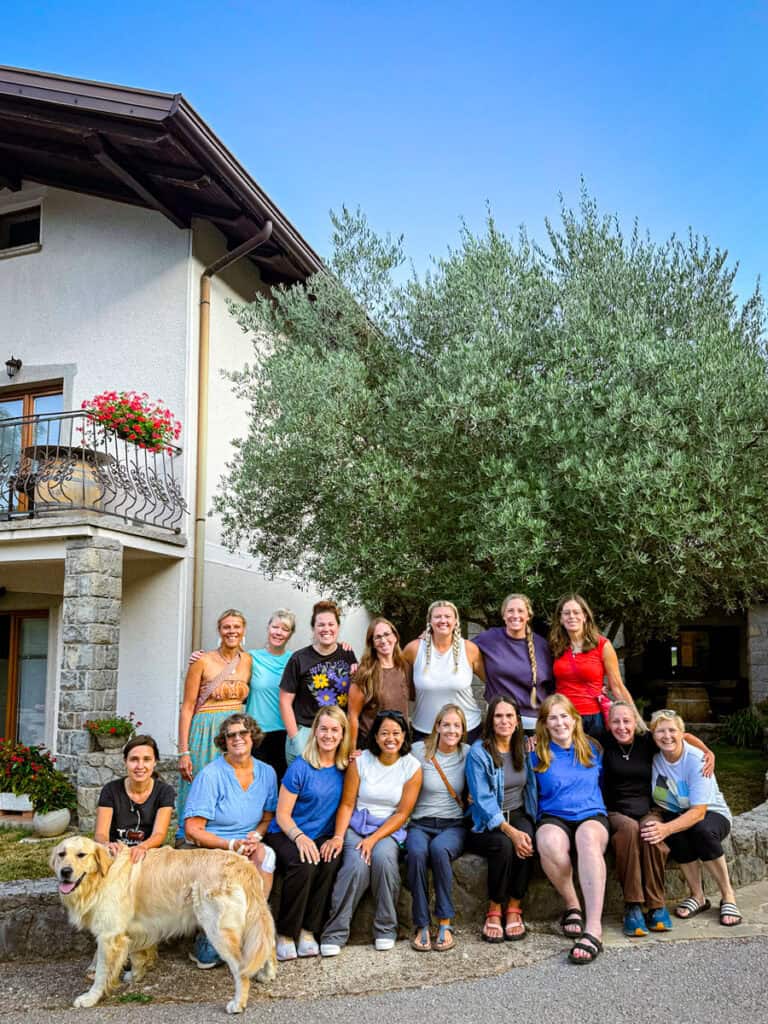 group taking hoto with owner at san martin hotel