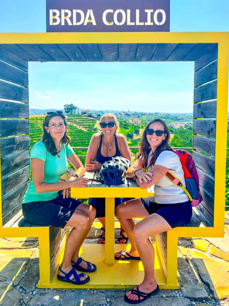 women sitting with view of vineyards in the valley of Goriška Brda