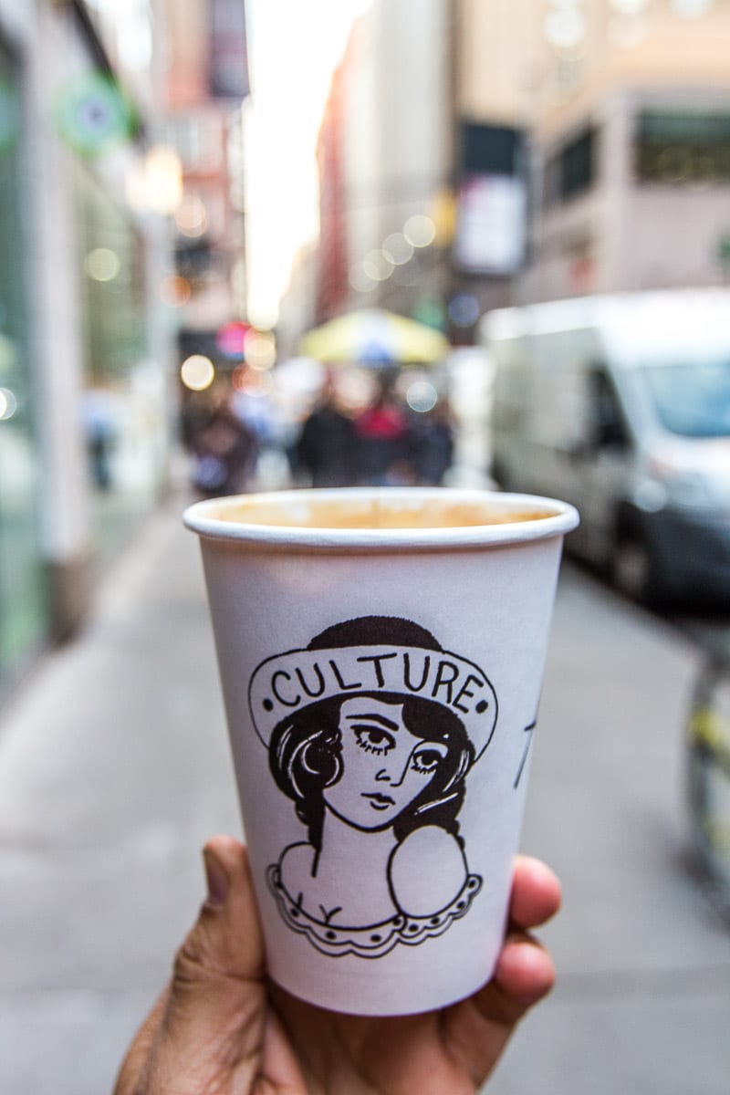 man holding Culture Espresso cup
