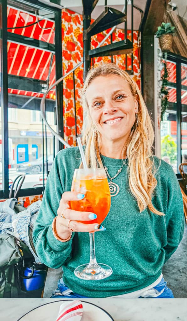 woman with aperol spritz