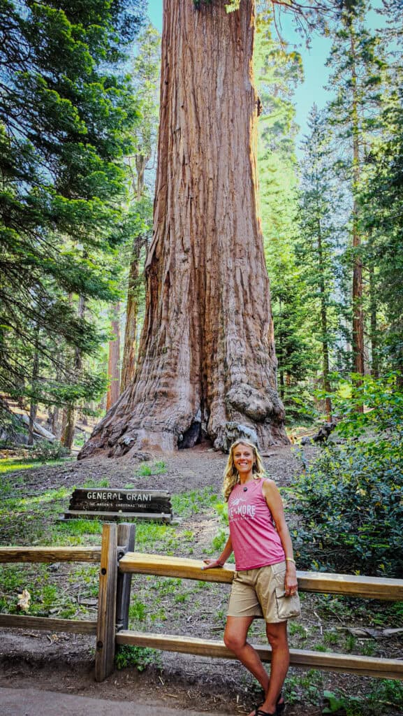 woman standing in front of general grant tree kings canyon
