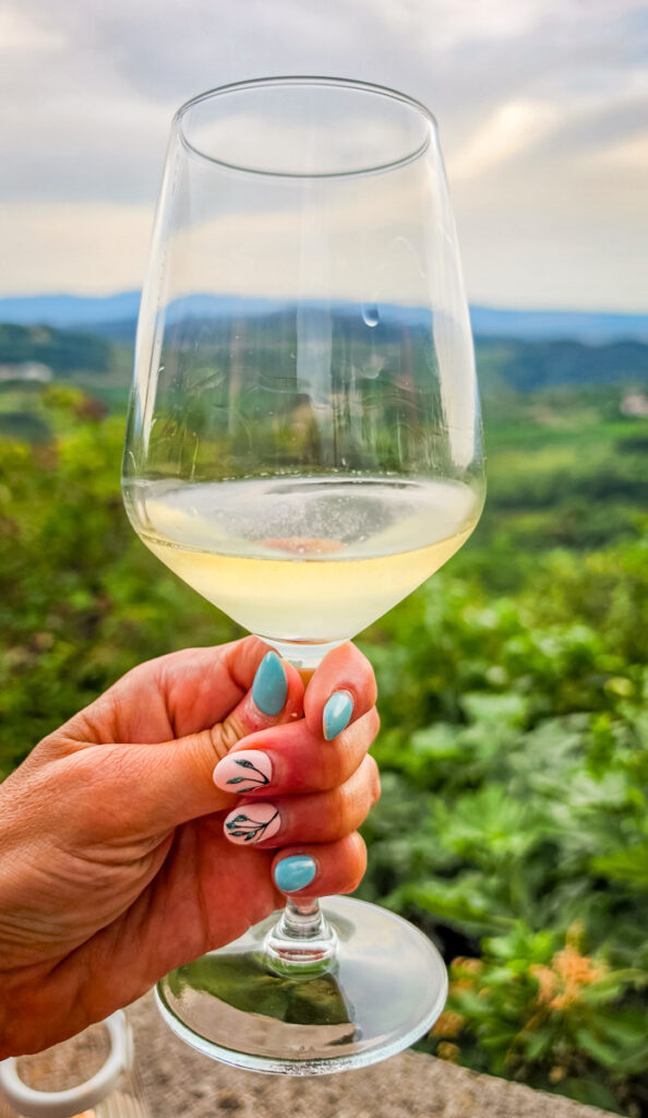 woman holding glass of wine