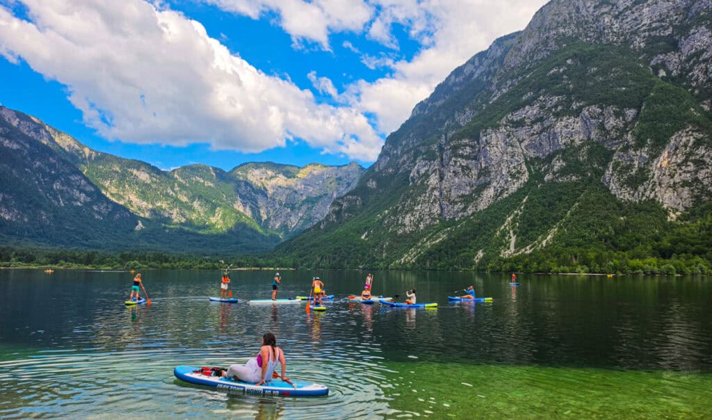 paddleboarders on lake bohinj