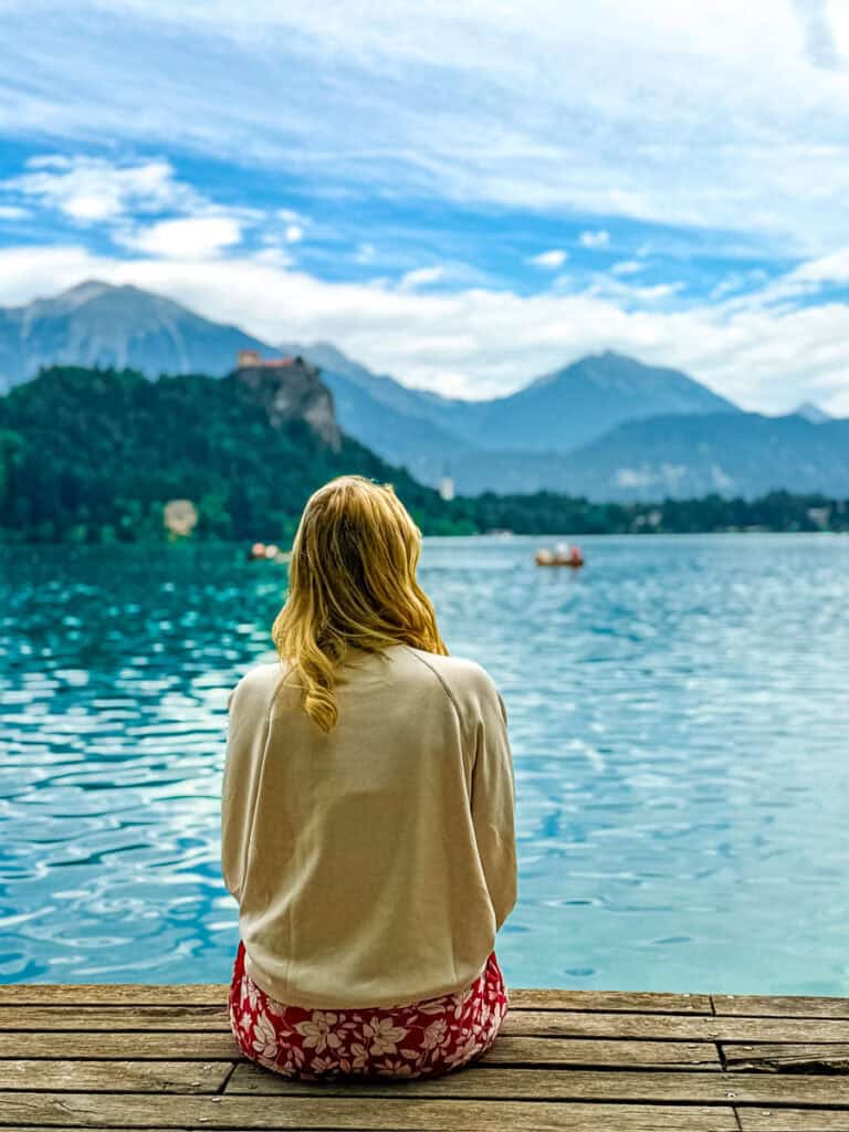 woman looking at view of lake bled from bled island
