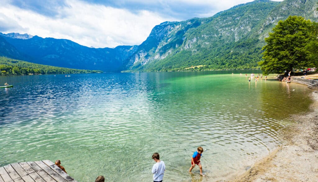 kids playing in water at lake bohinj