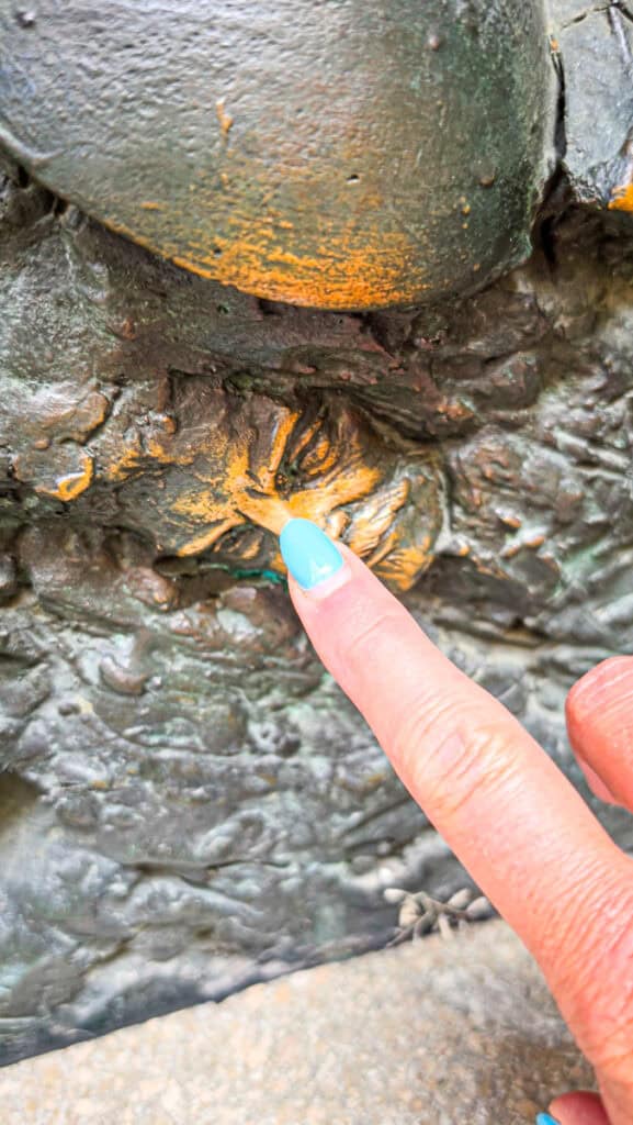 person rubbing nose of artist on f The bronze door of the Cathedral of St Nicholas