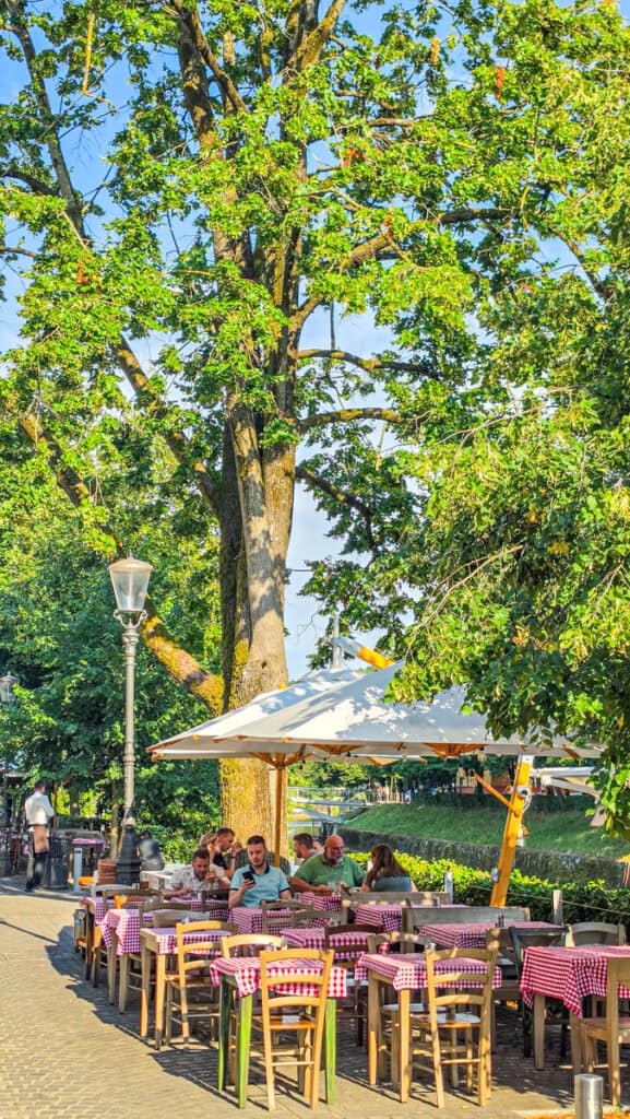 tables on patio near river at Baščaršija on Trubarjeva