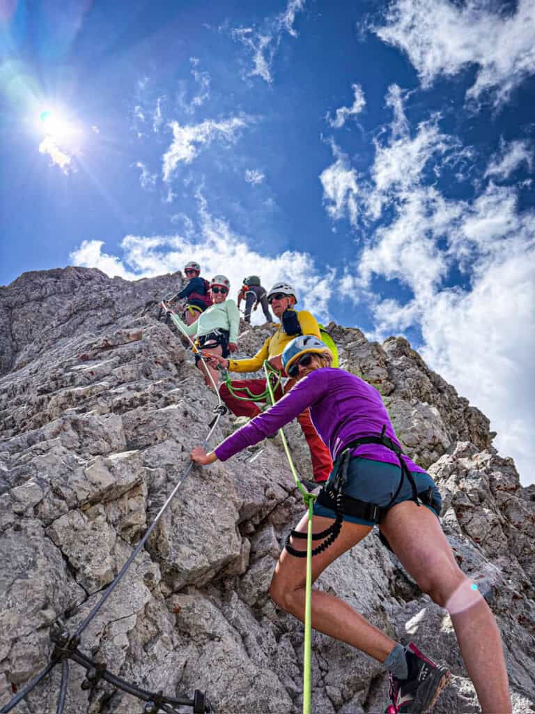 girls climbing via feratta to mt triglav summit