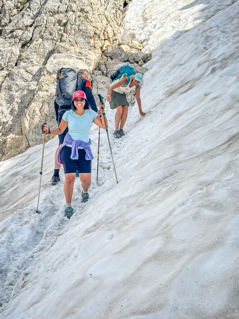 girls hiking through snow mt triglav