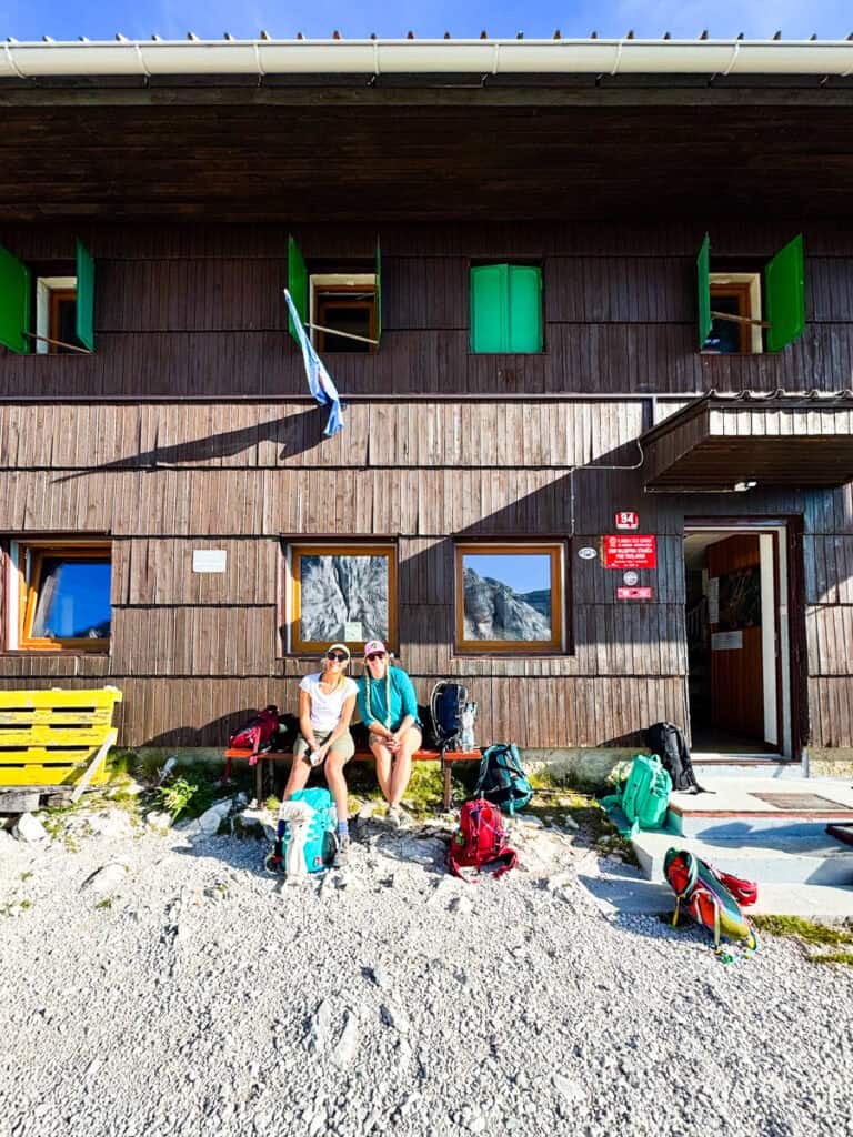 two women sitting near mt triglav hut