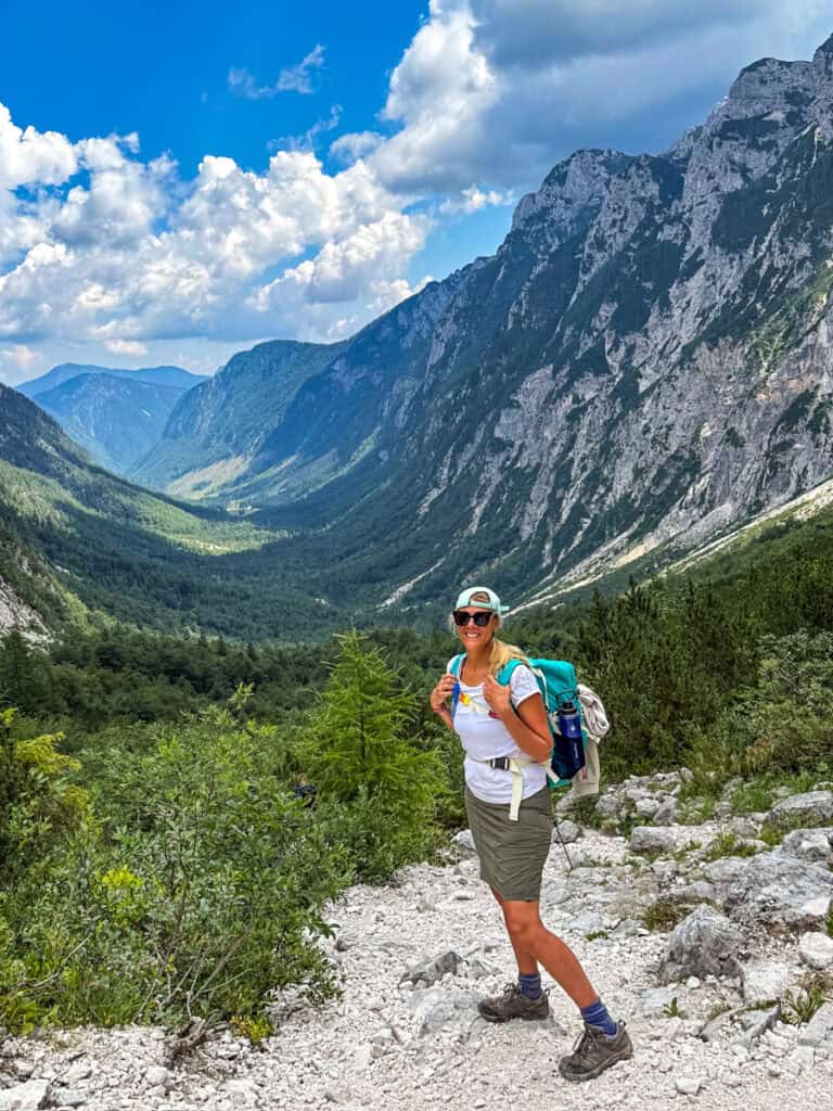 wman with backpack with view of krma vlley