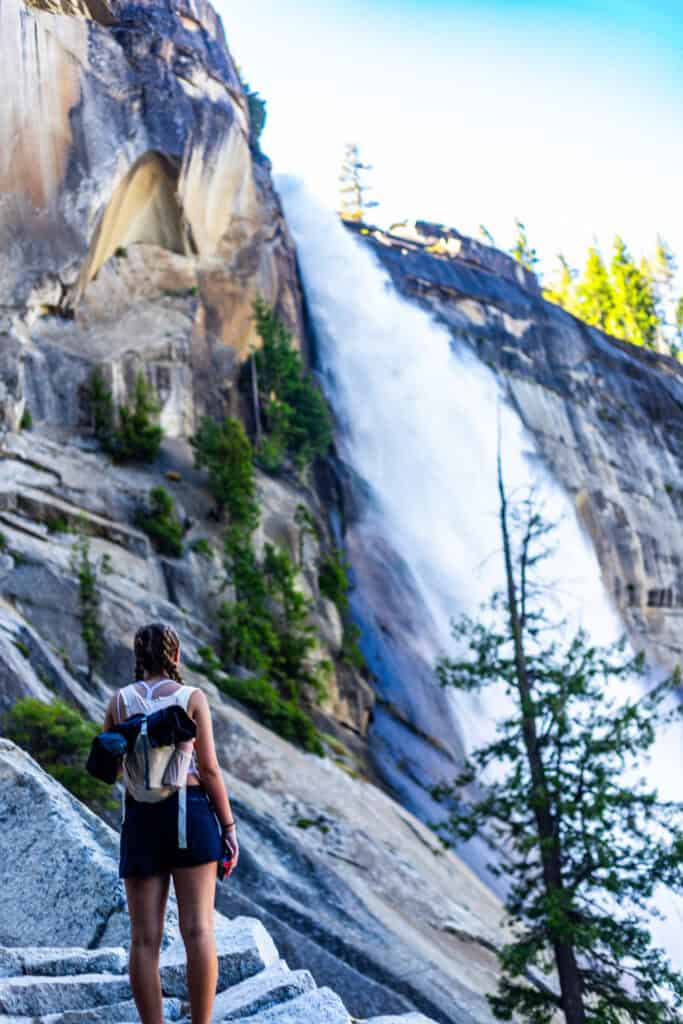 girl looking at nevada fall from the stairs to the side