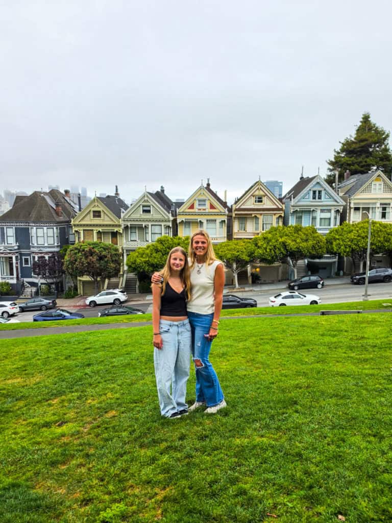 mother and daughter in front of painted ladies