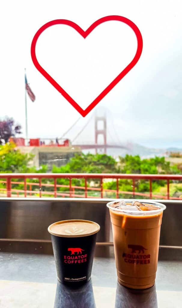 love heart on window with golden gate bridge in background and two coffees