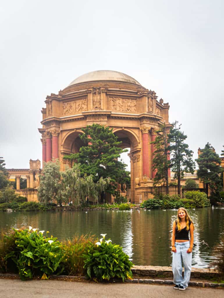 girl posing in front of palace of fine arts