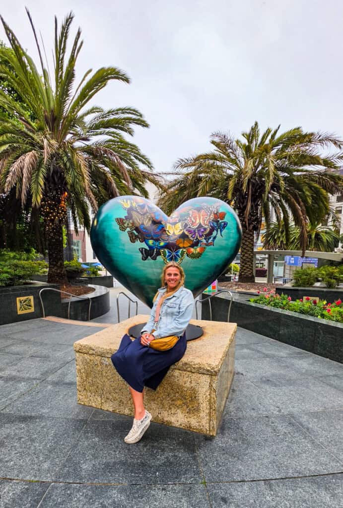 woman next to san francisco heart