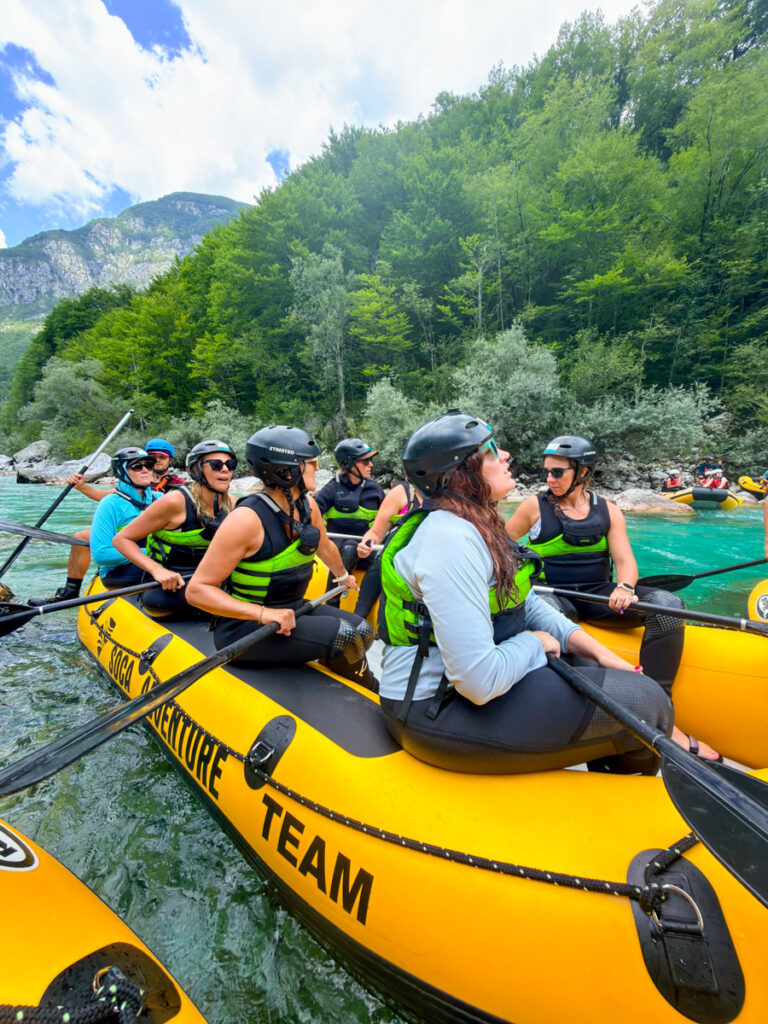 women on whitewater raft on soca river
