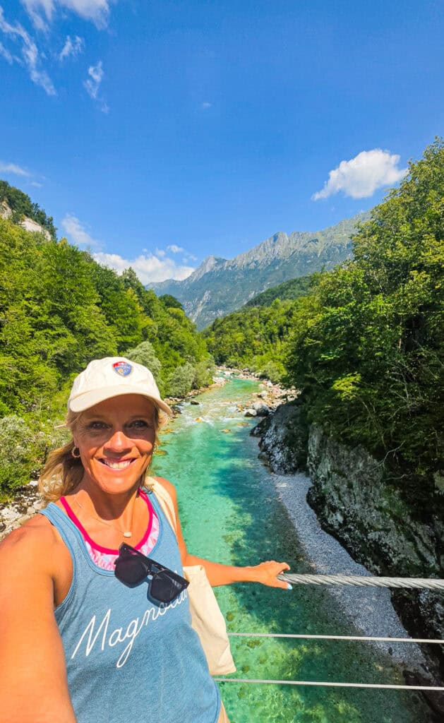 woamn taking selfie in front of soca river
