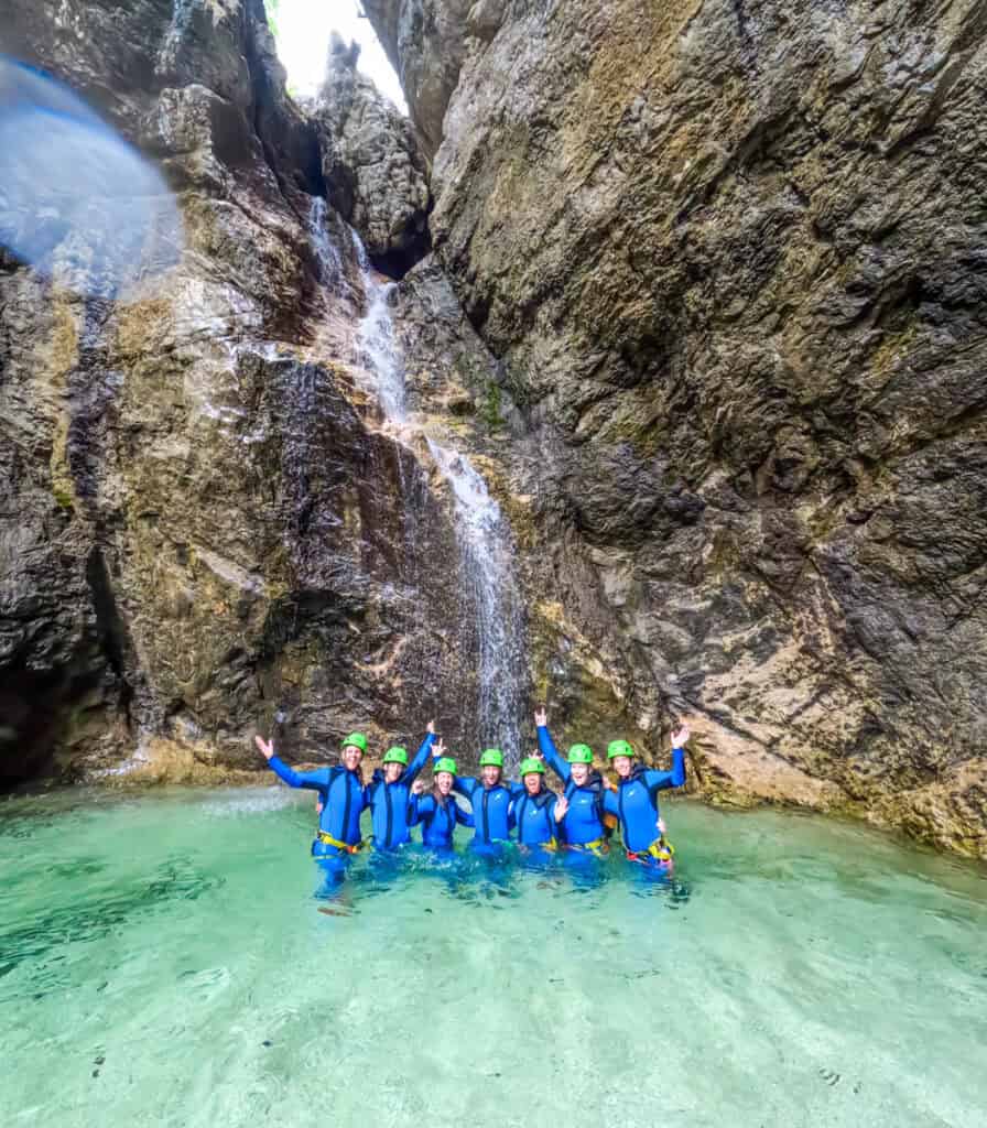 women in pool of water in canyon soca valley