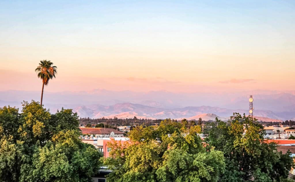sunset views of sierra nevada from elderwood rooftip visalia