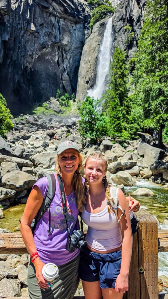 mother and daughter in front of yosemite falls