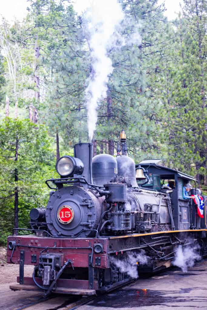 old logger steam train blowing smoke